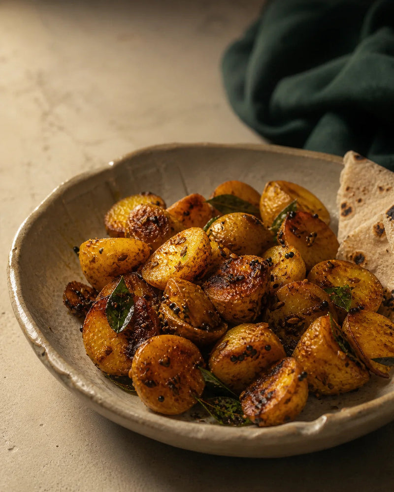 GetPured Everyday Aloo Sabzi, cubed potatoes tossed with Rajasthan coriander powder, cumin, turmeric and curry leaves, served with roti