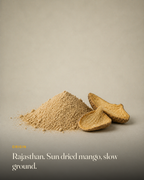The ingredient behind GetPured Amchur Powder, photographed on a warm studio backdrop with a caption naming its origin and how it is made