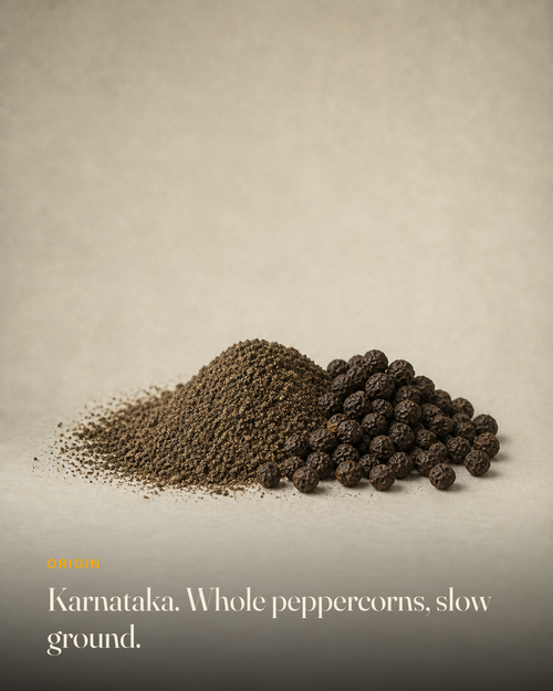 The ingredient behind GetPured Black Pepper Powder, photographed on a warm studio backdrop with a caption naming its origin and how it is made