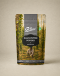 GetPured Black Pepper Powder 100g pack photographed on a warm studio backdrop