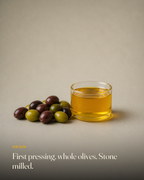 The ingredient behind GetPured Cold Pressed Extra Virgin Olive Oil, photographed on a warm studio backdrop with a caption naming its origin and how it is made