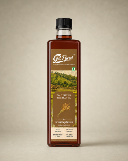 GetPured Cold Pressed Rice Bran Oil 500ml pack photographed on a warm studio backdrop
