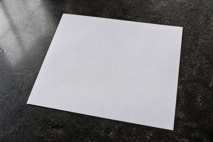 A drop of GetPured cold pressed rice bran oil dried on white blotting paper leaving no greasy stain, the at-home mineral-oil test