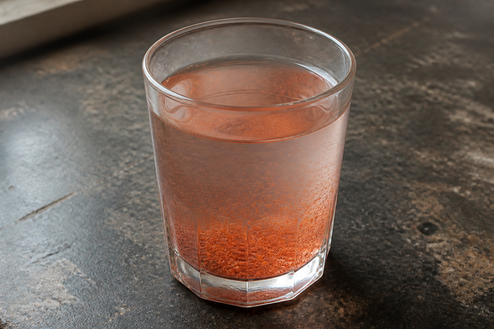 GetPured red chilli powder stirred into a glass of water, the colour spread gradually and a layer of natural chilli settled at the bottom, the at-home dye test